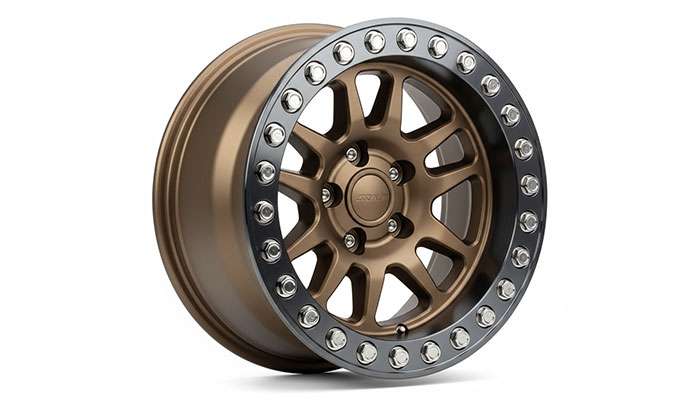 Beadlock rim with external clamping ring showing multiple bolts securing tire bead