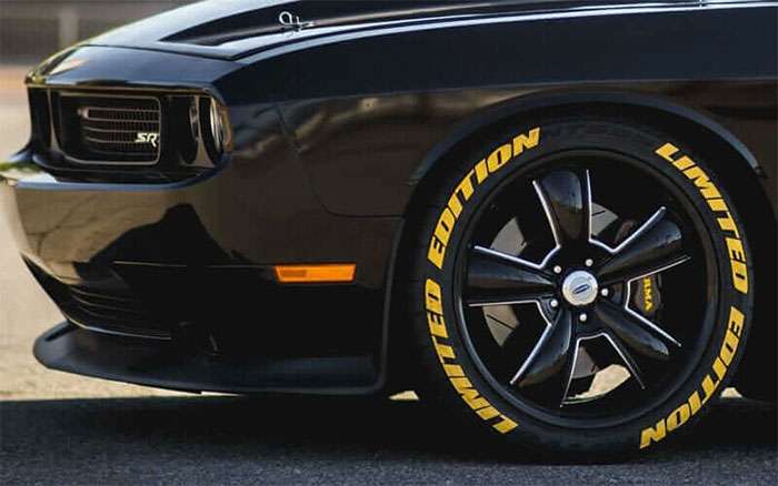 Close-up of a black muscle car front wheel featuring Cragar Classic-style rims and yellow Limited Edition tire lettering