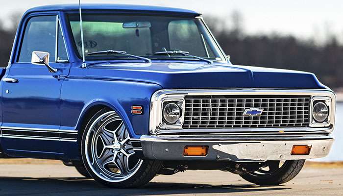 Close-up of a blue classic Chevrolet truck featuring Chip Foose custom wheels and rims with free shipping offer