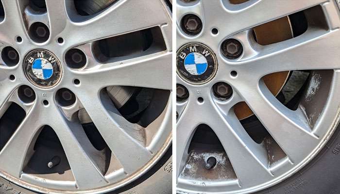 Alloy wheel coated with dark brake dust buildup.