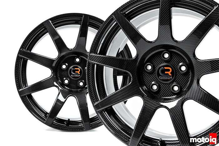 Two black carbon fiber car wheels with a CR Carbon Revolution logo on a white background.