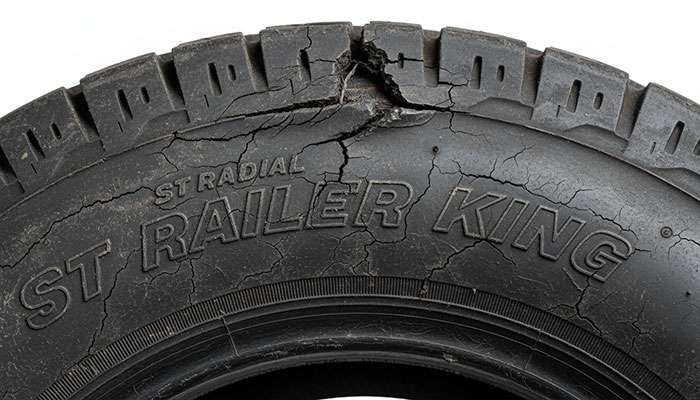 Close-up of low-quality trailer tire showing manufacturing defects and poor construction typical of China bomb tires