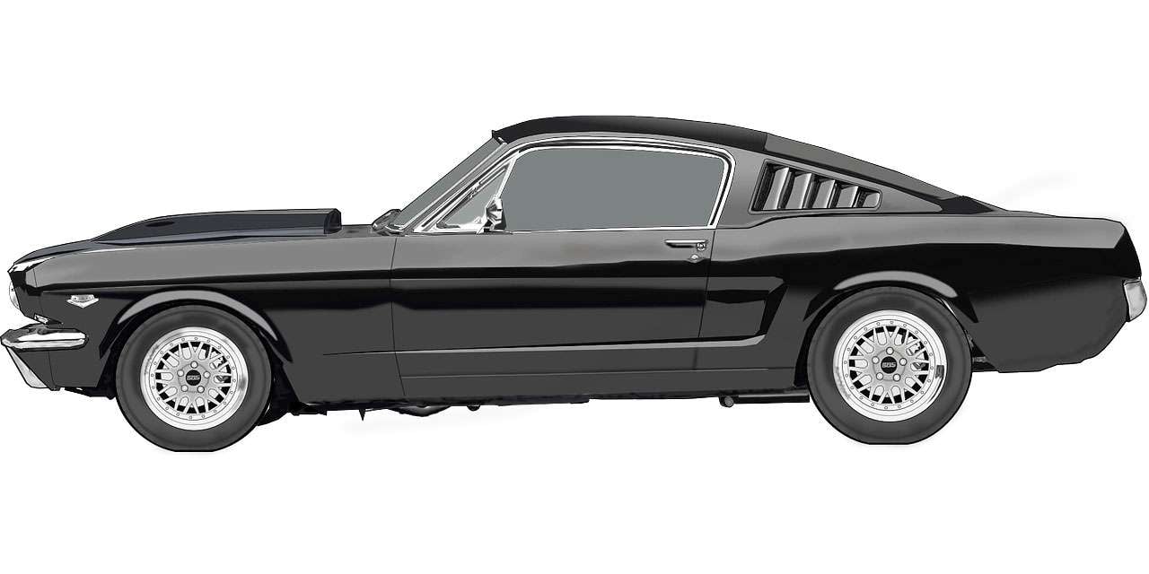 Side view of a classic black Ford Mustang fastback sports car with silver wheels and sleek design.