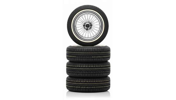 Set of four 16-inch classic cross lace chrome wire wheels with Vogue white and yellow stripe tires