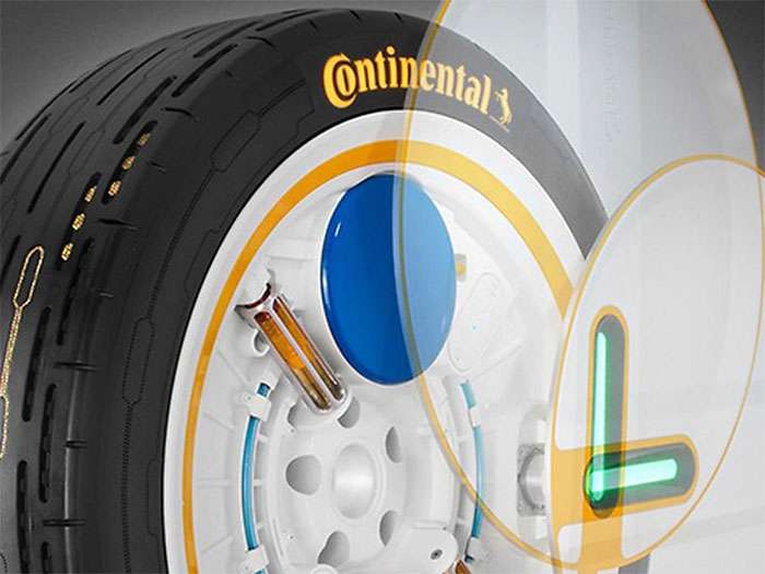 Close-up of Continental's concept self-inflating tire showing internal components and branding on the sidewall.