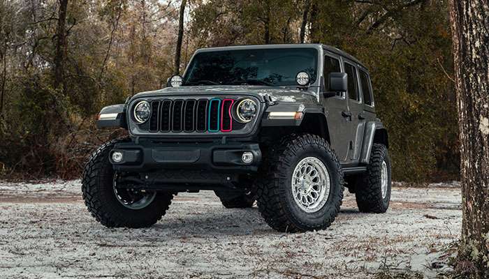Close-up off-road vehicle with Fittipaldi Off Road wheel and rugged tire