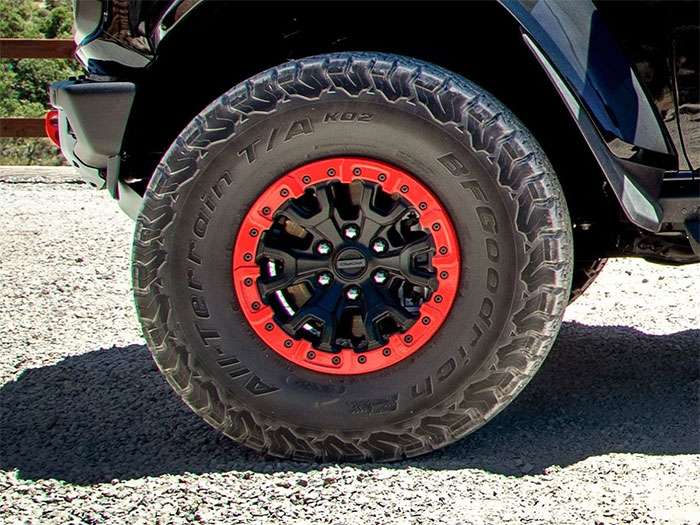 Forged aluminum off-road wheel mounted on 4x4 truck in desert