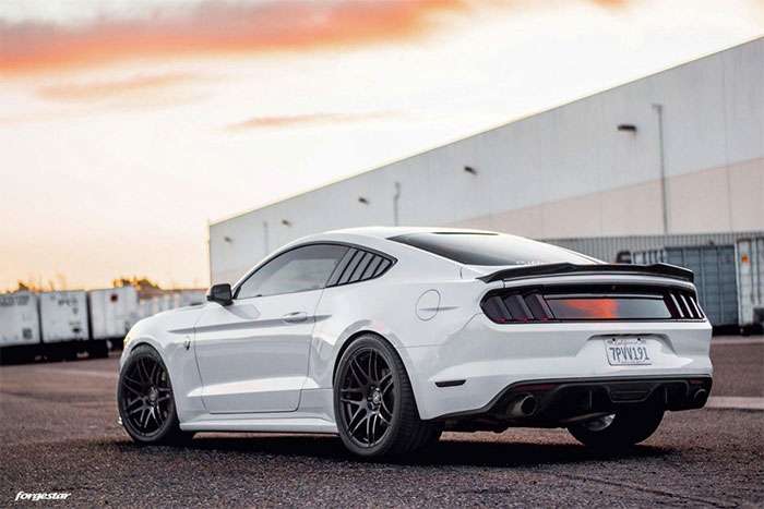 Forgestar F14 wheels mounted on an S550 Mustang in matte black finish.