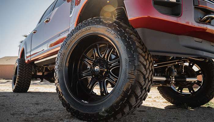 Fuel Off-Road Lethal D567 black alloy wheel with aggressive tread tire mounted on vehicle