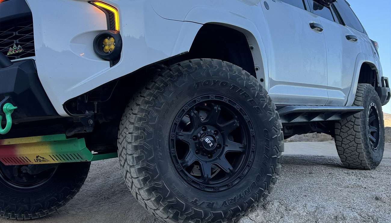 Close-up of a sleek black GFx alloy wheel with a modern multi-spoke design