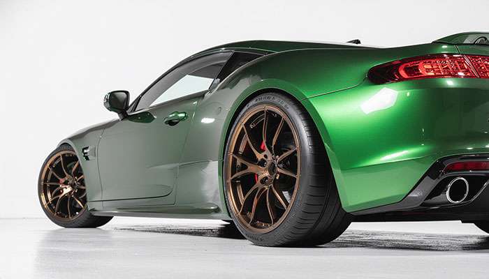 Deep green car with a wrap and bronze wheels showcased on TikTok