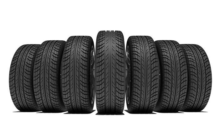 Close-up of a GT Radial tire showing detailed tread pattern on an SUV in outdoor setting