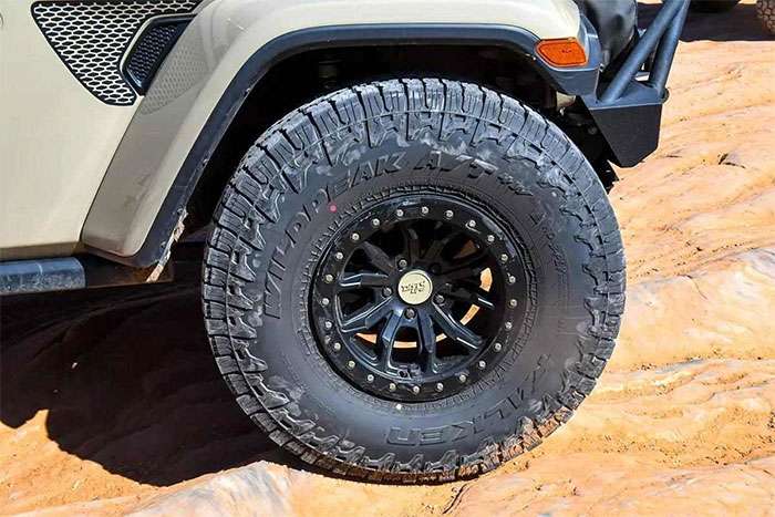 Hybrid off-road tire showing specialized tread design with center highway pattern and aggressive shoulder lugs