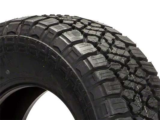 Close-up of a Kenda KLEVER A/T2 KR628 all-terrain tire with aggressive tread pattern, size 33' - 285/70R17