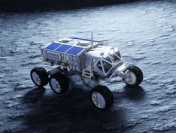 Six-wheeled lunar rover at night illustrating advanced tire technology and materials