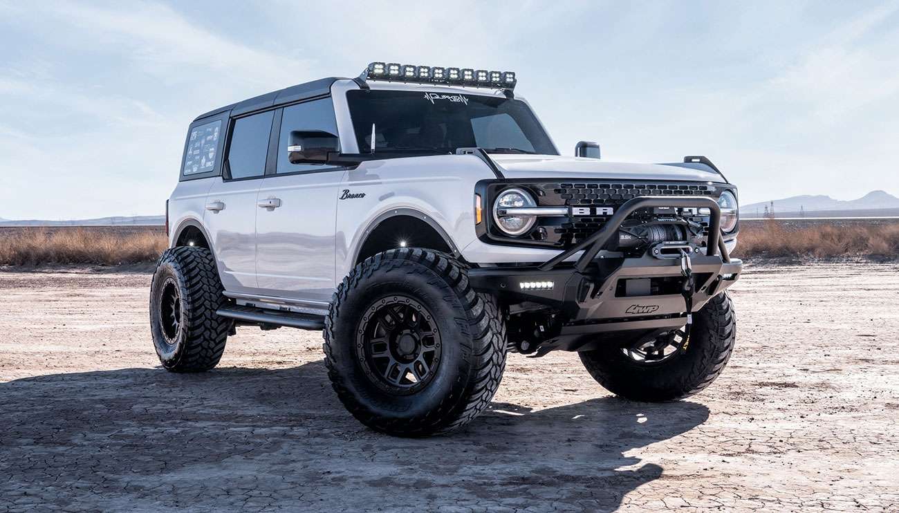 Mayhem Warrior matte black wheel on a Bronco with aggressive off-road styling and split-spoke design