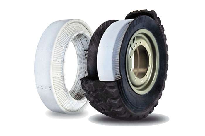 Cutaway view of a military Humvee run-flat tire system showing tire, inner support, and wheel components