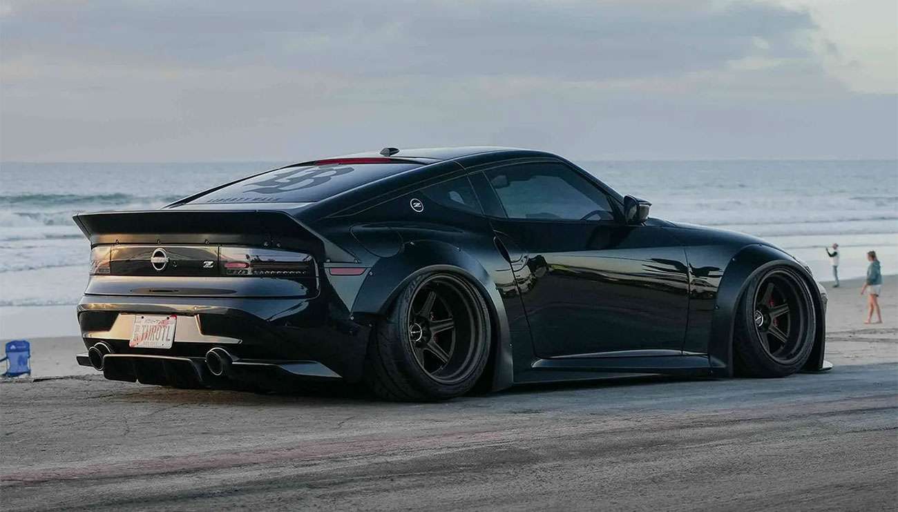 Close-up of black sports car with Motegi wheels