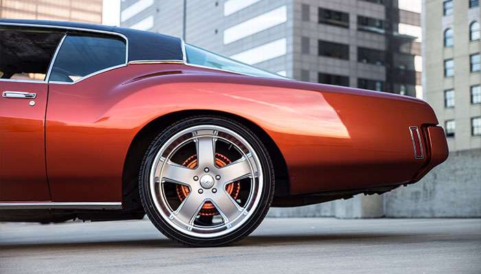 Close-up of a sleek MV Forged bespoke forged wheel with detailed precision craftsmanship