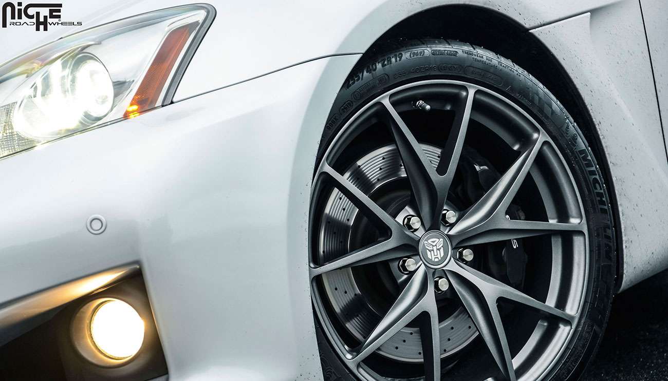 Niche silver wheel on white sports car