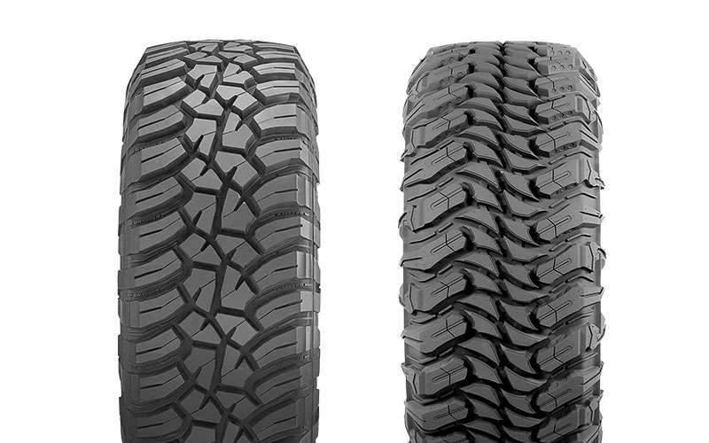 Close-up of two off-road tire treads showing deep grooves and aggressive patterns for traction in snow and rough terrain.