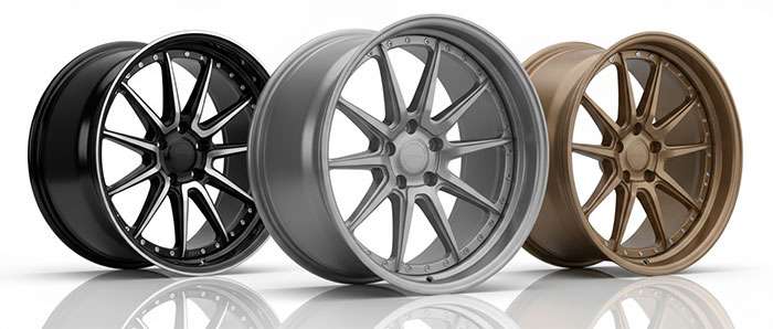 Premium forged aluminum wheels with intricate spoke designs showcasing high-end construction quality