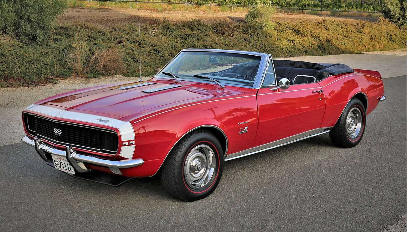 Classic Chevrolet muscle car with polished steel rally wheels