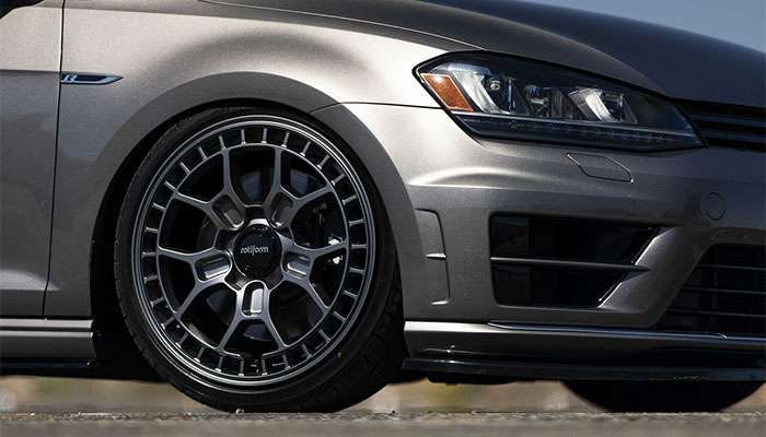 Close-up of a gray 2015 Volkswagen Golf R featuring Rotiform ZMO-M wheels in bright daylight