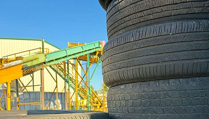 Stacks of used tires at a tire recycling and disposal facility in Northwest Arkansas.
