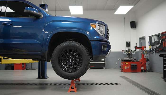 Truck with properly fitted tires showing correct wheel well clearance and suspension fitment