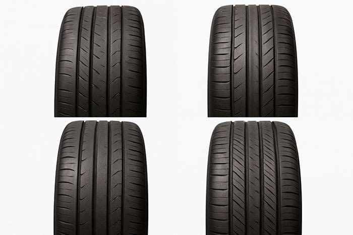 Four tires showing different uneven wear patterns caused by incorrect wheel offset and alignment issues