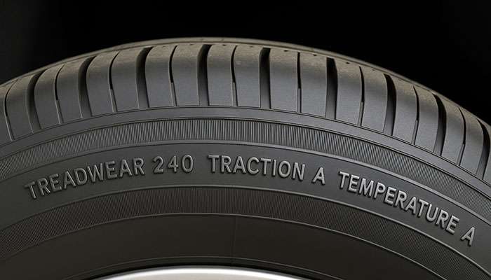 Tire showing tread wear, traction, and temperature ratings.