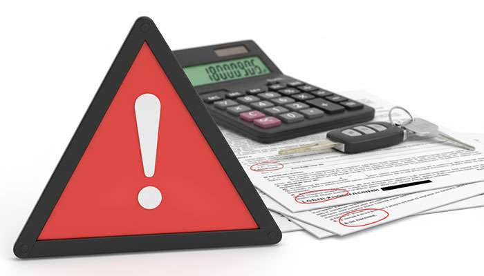 Warning sign highlighting the importance of being aware of hidden fees and terms