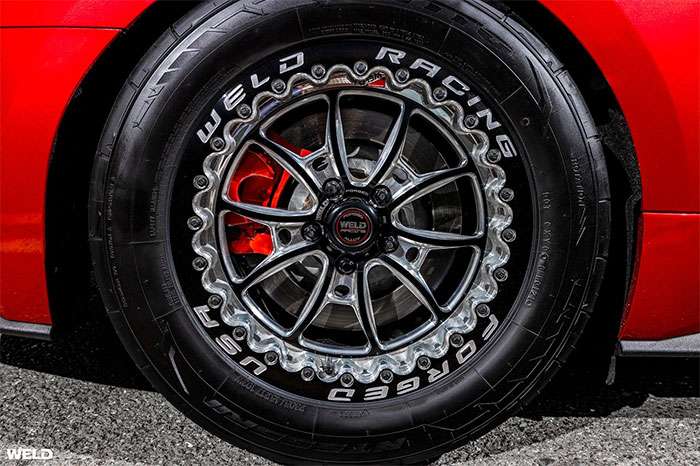 Weld Racing drag wheel with lightweight design on a clean studio platform
