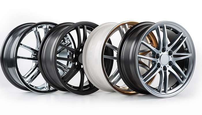 Collection of wheels showing various finish types including chrome, powder coat, and painted options
