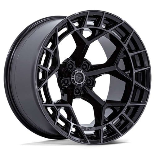 Forged three-piece custom wheel mounted on a performance car.